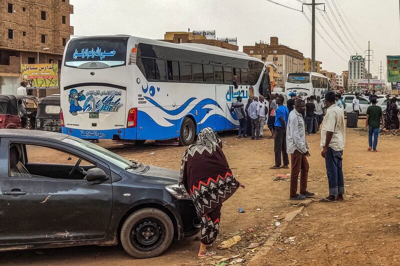 People prepare to board a bus departing from Khartoum in the Sudanese capital on April 24th, as battles rage in the city between the army and paramilitaries. Photograph: AFP via Getty