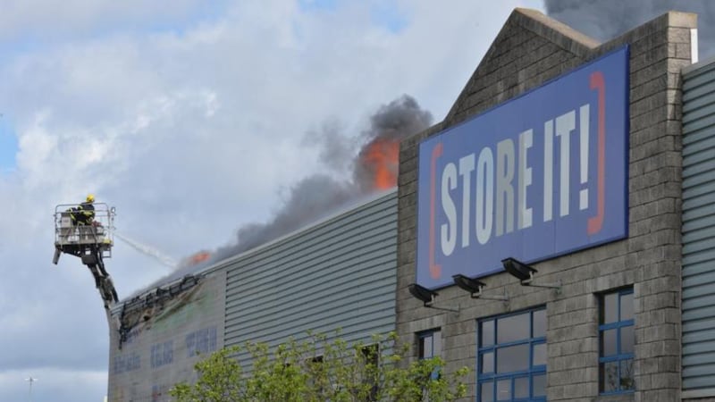 Dublin Fire Brigade tackles the fire at Ballymount yesterday. Photograph: Alan Betson/The Irish Times