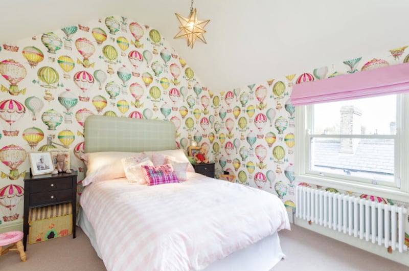 The bedroom has Manuel Canovas L’envol, featuring a hot air balloon motif wallpaper