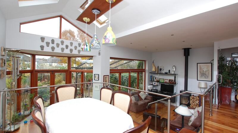 The split-level open-plan room at the rear of the house, with living and dining areas