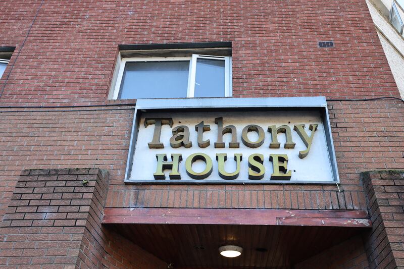 The words 'Tathony House' are spelt out in golden letters above the door of the building. Photograph: Dara Mac Dónaill