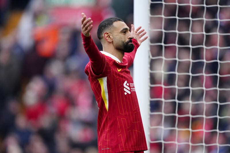 Mohamed Salah celebrates scoring a penalty for Liverpool. Photograph: PA