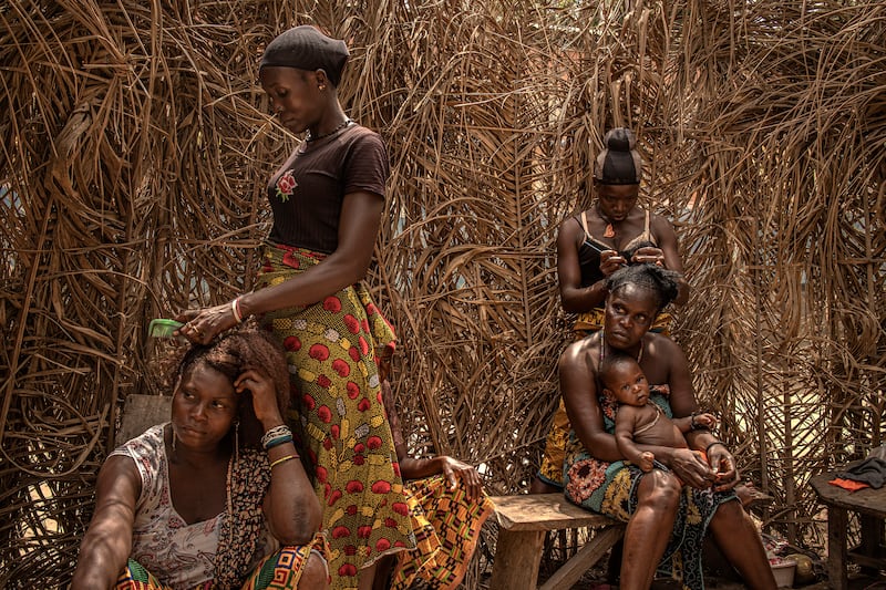 Hair care in the village of Fonkoye, Sierra Leone.