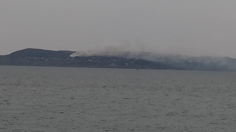 A thick plume of smoke seen rising from the south side of Howth Head