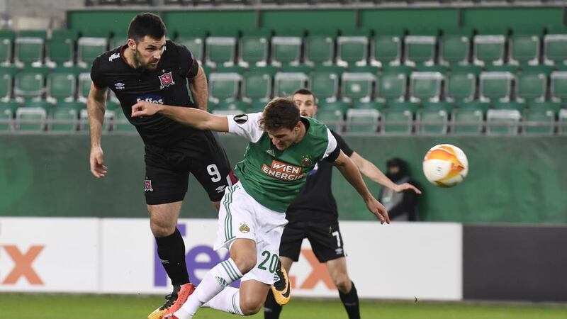 Dundalk’s  Patrick Hoban  beats Maximilian Hofmann of Rapid Vienna to head home the opening goal  during the Uefa Europa League Group B match. Photograph: Christian Bruna/EPA