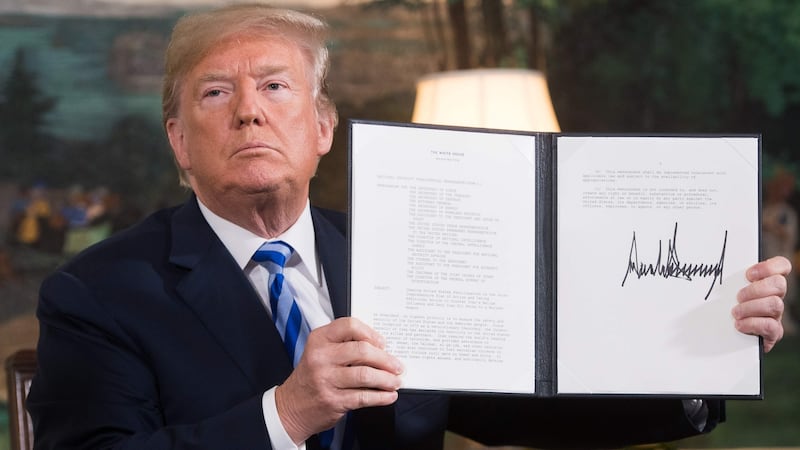 Former US president Donald Trump with a document outlining sanctions against Iran after he announced the US withdrawal from the Iran nuclear deal . Photograph: Saul Loeb/AFP/Getty Images