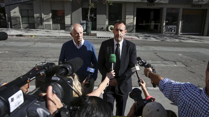 Philip Grant, Consul General of Ireland to the western United States (right) speaks to the media with Berkeley Mayor Tom Bates (left) following a wreath-laying ceremony at the scene of a 4th-story apartment building balcony collapse in Berkeley, California where six Irish students died on Tuesday. Photograph: Reuters