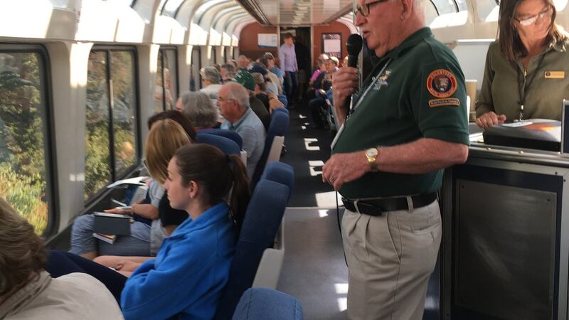 Passengers on the Amtrak train that crosses the Rocky Mountains on its way from Denver to Salt Lake City admire the view while hearing an account of the history of the area. Photograph: Suzanne Lynch