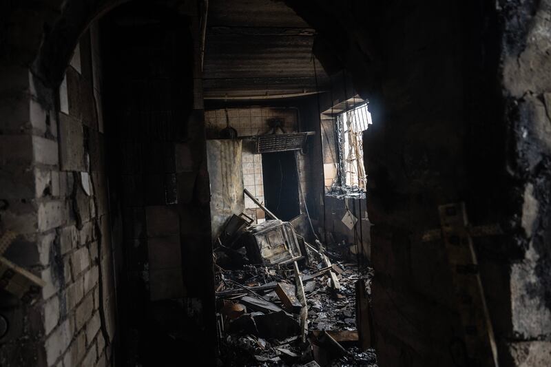 Home burns after Ukrainian fuel depot struck by Russian drones in Kharkiv. Photograph: Lynsey Addario/The New York Times
                      