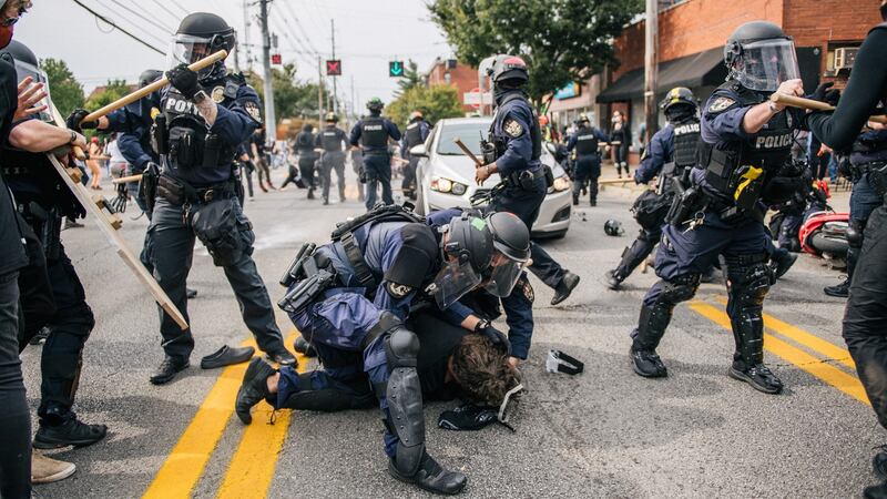 Protester detained by police during demonstration in Kentucky. Photograph: Getty