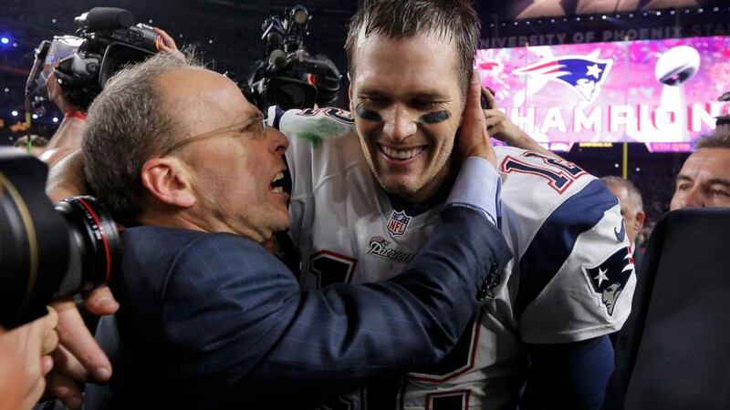 New England Patriots quarterback Tom Brady is congratulated by team president Jonathan Kraft. Photograph: Brian Snyder/Reuters