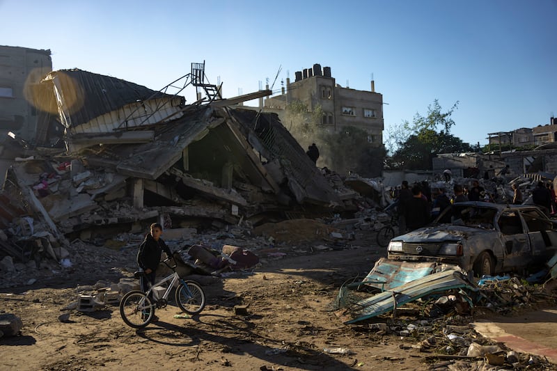 Palestinians search for bodies and survivors in the rubble of a residential building destroyed in an Israeli air strike in Rafah, southern Gaza, on Friday. Photograph: Fatima Shbair/AP