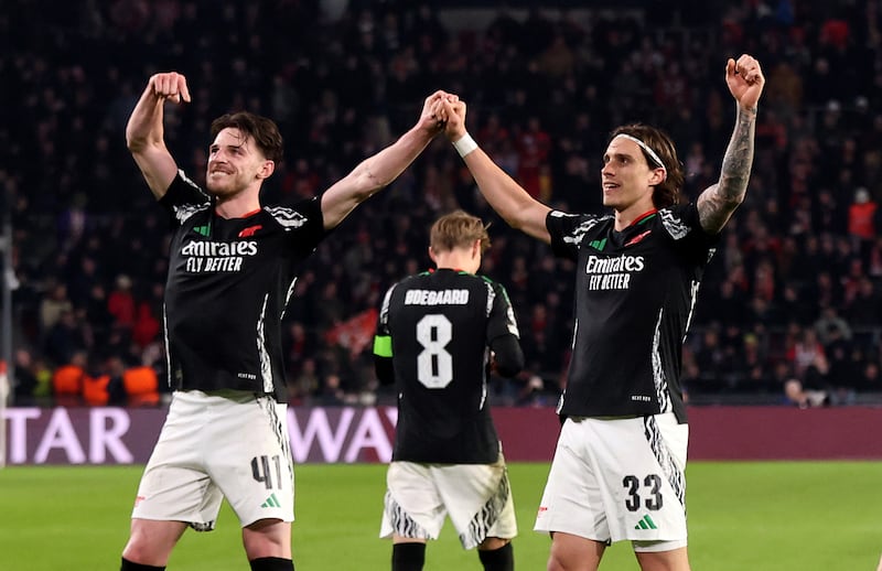 Arsenal's Riccardo Calafiori celebrates scoring with team-mate Declan Rice. Photograph: Peter Lous/PA