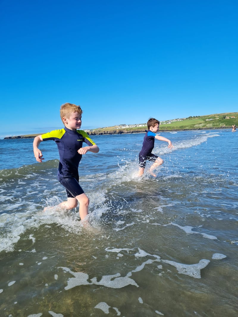 Chasing waves at Poppit Sands beach, at the mouth of the Teifi estuary. Joanne Hunt and family for travel feature on Wales