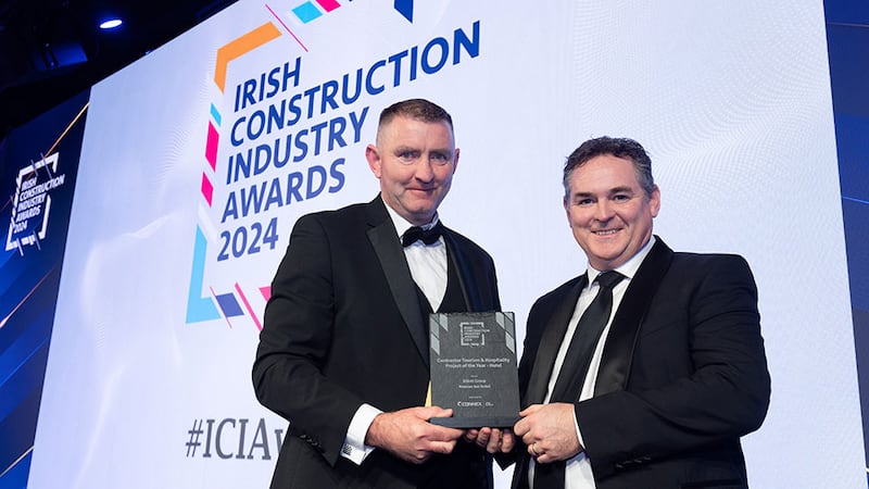 Brian MC Donell, senior project manager at Connex Offsite, presents the contractor tourism & hospitality project of the year - hotel award to Gary O'Sullivan, Elliott Group