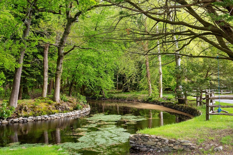 Grounds include a river, lake, streams and 100 acres of gardens and parklands