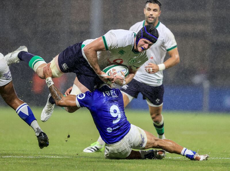 Ireland’s Ryan Baird with Jonathan Taumateine of Samoa. Photograph: Dan Sheridan/Inpho 