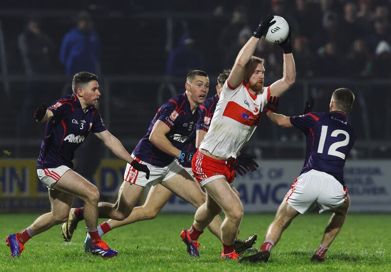 Coolera’s Sean Taylor under pressure from the Cuala defence. Photograph: Lorraine O’Sullivan/Inpho 