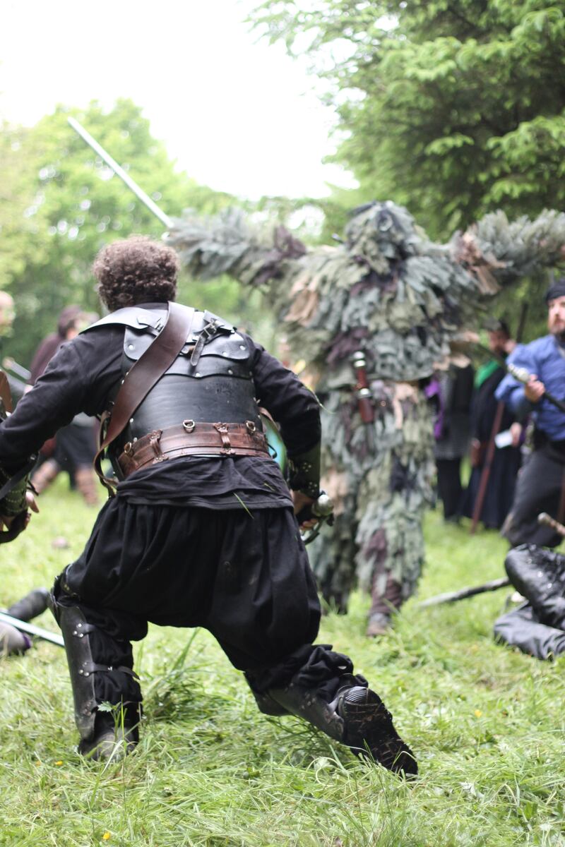 Players attempt to defeat a rogue 'bush' (a man in a ghillie suit) tormenting the camp. Photograph: Allan Leeson