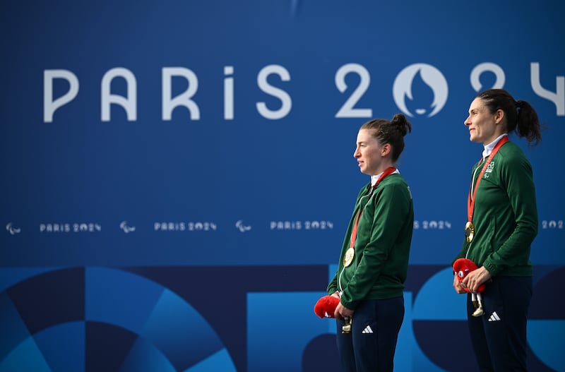 Katie-George Dunlevy, right, and pilot Linda Kelly of Ireland with their gold medals after winning the women's B individual time trial on day seven of the Paris 2024 Paralympic Games at Clichy-sous-bois in Paris, France. Photograph: Ramsey Cardy/Sportsfile