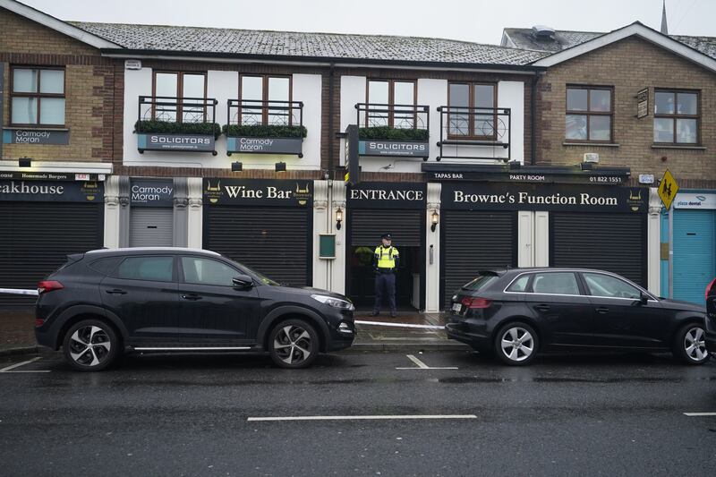 Gardaí outside Browne's Steakhouse in Blanchardstown where Jason Hennessy was wounded on Christmas Eve. Photograph: Niall Carson/PA Wire