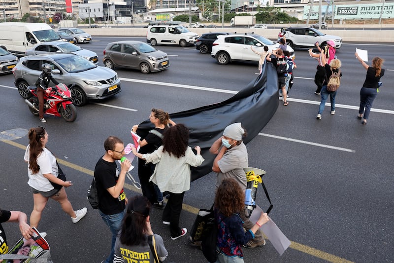 Relatives and supporters of Israeli hostages held in Gaza block Ayalon Highway iin Tel Aviv during a demonstration calling for their release Photograph: Jack Guez/AFP