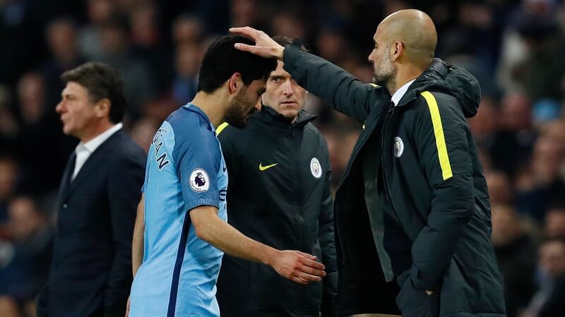 Ilkay Gundogan with City boss Pep Guardiola: “It took a bit of time until everyone understood what our manager wanted from us. But we now feel that if we play well we will get the results. I’m really convinced that all the credit has to go to Pep.” Photograph:  Jason Cairnduff/ Livepic/Reuters