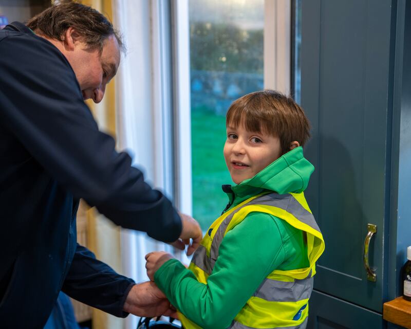 Dad Alan Browne from Fenit helps Diarmuid get set for his cycle to St. Brendan's National School Fenit on their bikes each day on the Fenit Greenway .
Photo By : Domnick Walsh