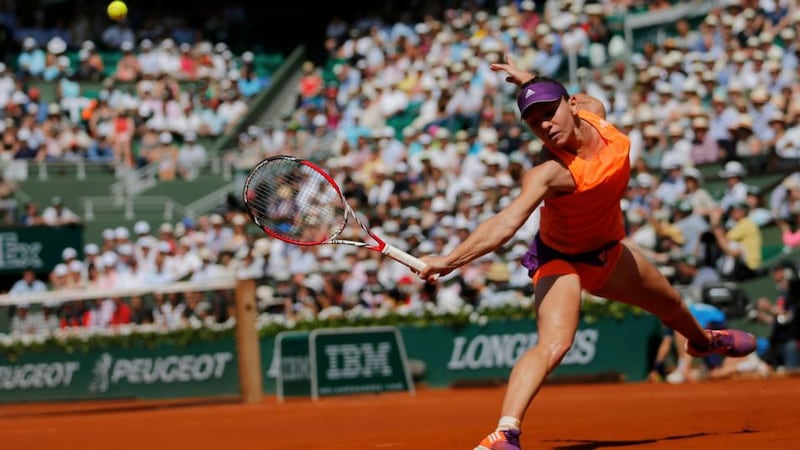 Simona Halep of Romania returns the ball to Maria Sharapova of Russia during the women’s French Open final  at the Roland Garros stadium in Paris . Photograph: Stephane Mahe / Reuters