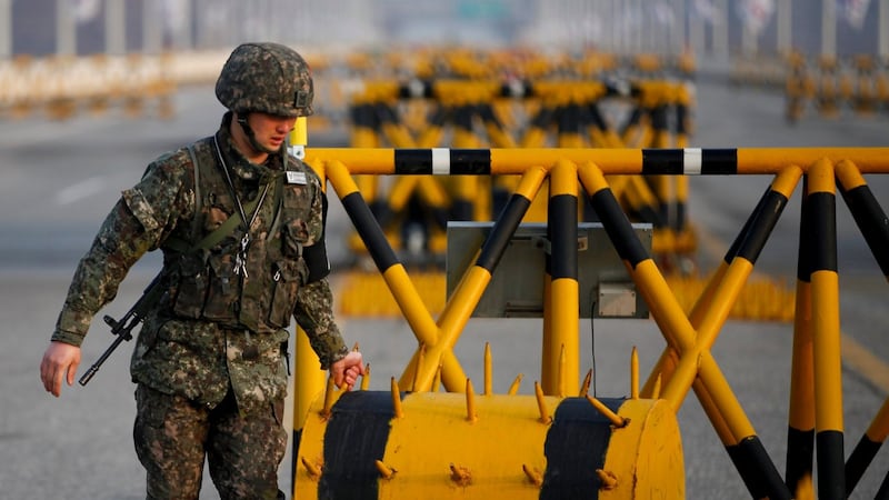 A South Korean soldier sets up a barricade at a checkpoint on the Grand Unification Bridge, which leads to the demilitarized zone separating North Korea from South Korea, in Paju, north of Seoul today. Photograph: Reuters