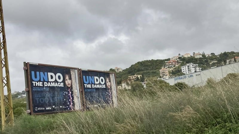 Billboards calling on the international community to 'undo the damage'.  Photograph: Hannah McCarthy