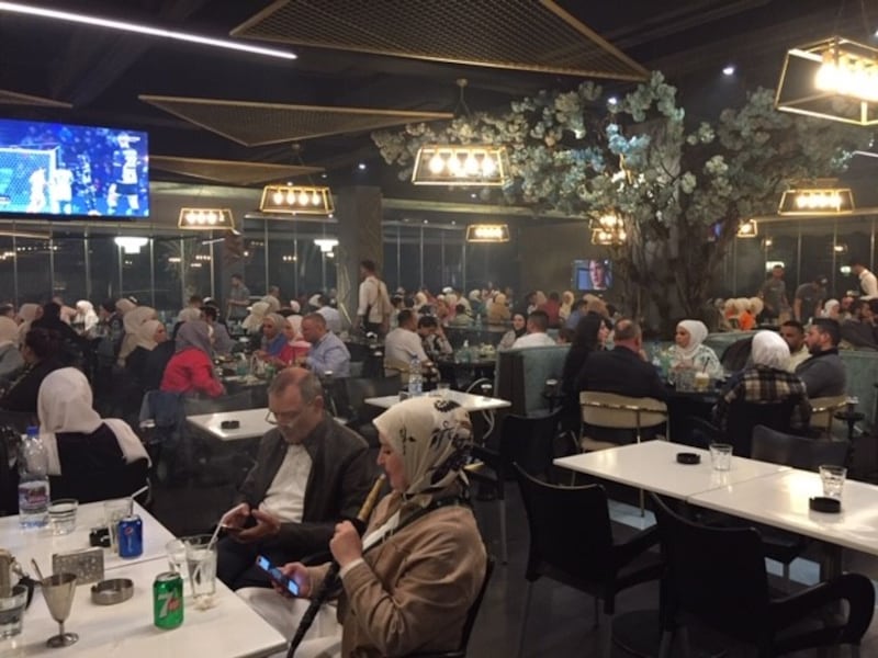 At the vast Tourquase restaurant, middle-class clients spend entire evenings sipping water and puffing on water pipes. Photograph: Michael Jansen