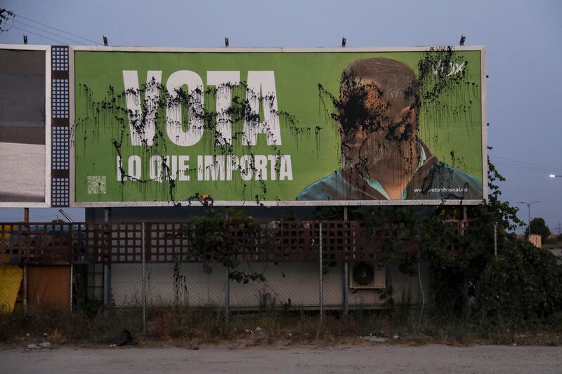 A billboard of far-right party Vox with an image depicting its leader Santiago Abascal is seen vandalised with black paint. Photograph: Pablo Blazquez Dominguez/Getty Images