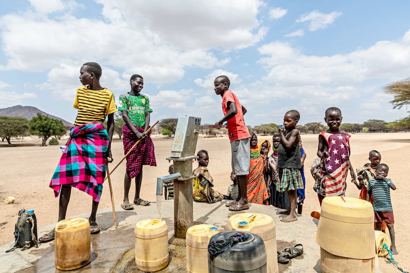 Children pump water at a tap in Kangalita,. a region in Kenya that has been severely affected by drought. Photograph: Natalia Jidovanu/Concern Worldwide