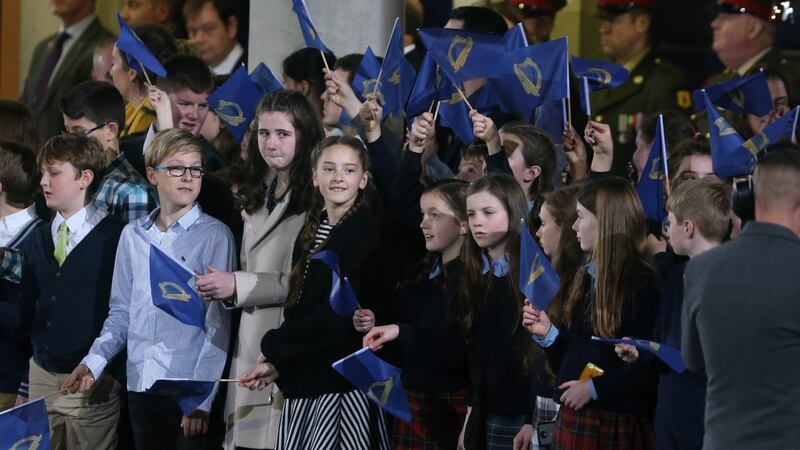 School children  prepare to cheer on the Army Band  at Dublin Castle, where President Michael D Higgins was inaugurated to his second term as President. Photograph:  Colin Keegan/Collins