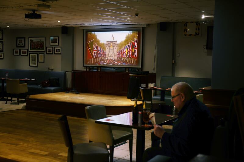 All quiet during the coronation ceremony in the bar of Tír na nÓg GAA club in Portadown, Co Armagh on Saturday. Photograph: Bryan O'Brien/The Irish Times 
