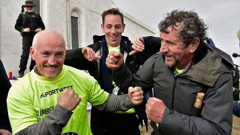 Climb with Charlie: Barry McGuigan and Ryan Tubridy with Charlie Bird on the summit of Croagh Patrick. Photograph: Conor McKeown