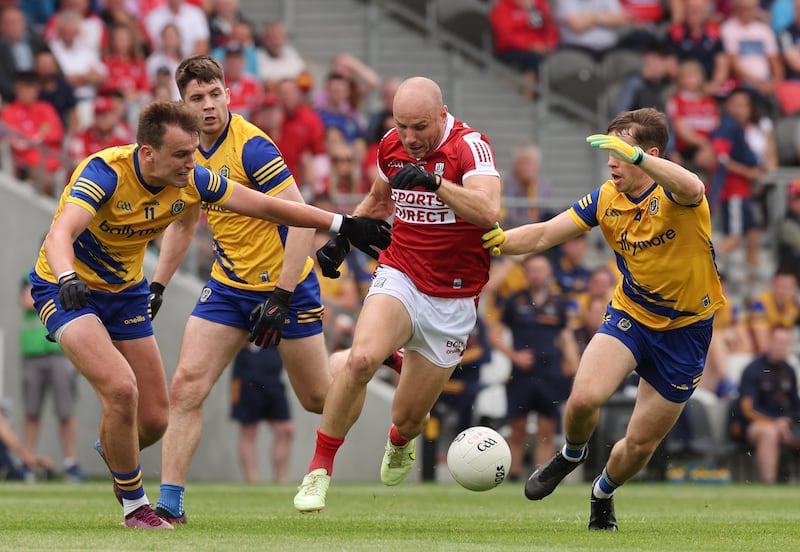 Cork's Brian O'Driscoll is tackled by Enda Smith and David Murray of Roscommon during Saturday's All-Ireland preliminary quarter-final. Photograph: Lorraine O’Sullivan/Inpho