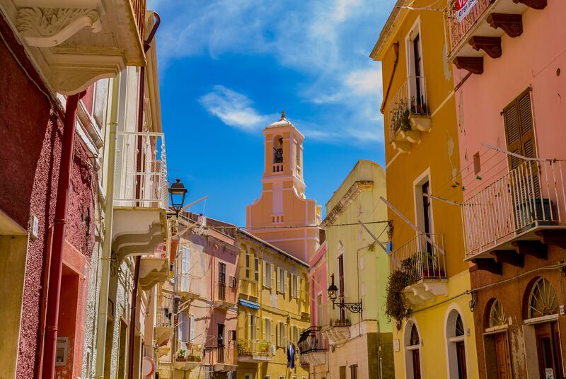 Palaces and a bell tower in Carloforte, Island of San Pietro, Carbonia-Iglesias, Sardinia. Photograph: Stefania Morelli/iStock