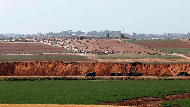 Palestinian demonstrators are seen gathering for a protest one day after clashes with Israeli forces on Land Day. At least 15 Palestinians in Gaza were killed by Israeli forces, the health ministry in the strip said. Photograph: Getty