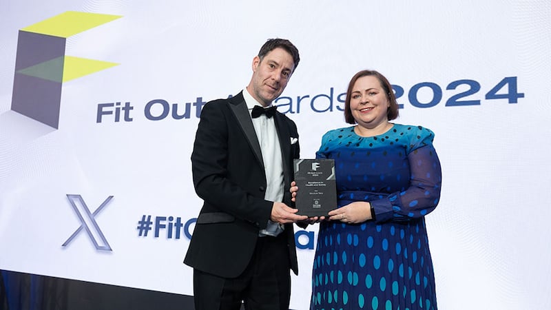 Diarmuid Condon, managing director of DCON Safety Consultants, presents the excellence in health and safety award to Deirdre Gingles, Structure Tone