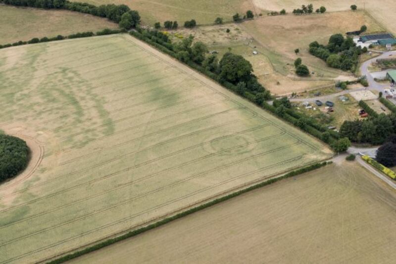 Great Timber Palisade: Analysis of aerial photographs by the Department has confirmed that arcs of postholes seen sweeping across the cropped field for a distance of over 900m form an immense series of timber palisade walls.