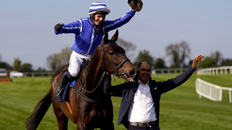 Jockey Paul Townend lifts the stablehand’s hat as he celebrates winning the William Hill Champion Chase on Energumene. Photograph: Niall Carson/PA