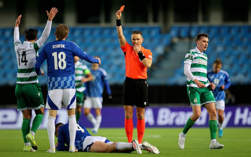 Referee Andris Treimanis shows a red card to Valdemar Lund of Molde. Photograph: Ryan Byrne/Inpho