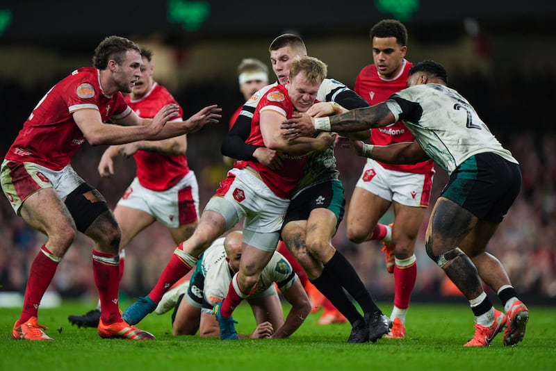 Wales' Blair Murray is tackled by Ireland's Sam Prendergast during the game in Cardiff. Photograph: Joe Giddens/PA Wire