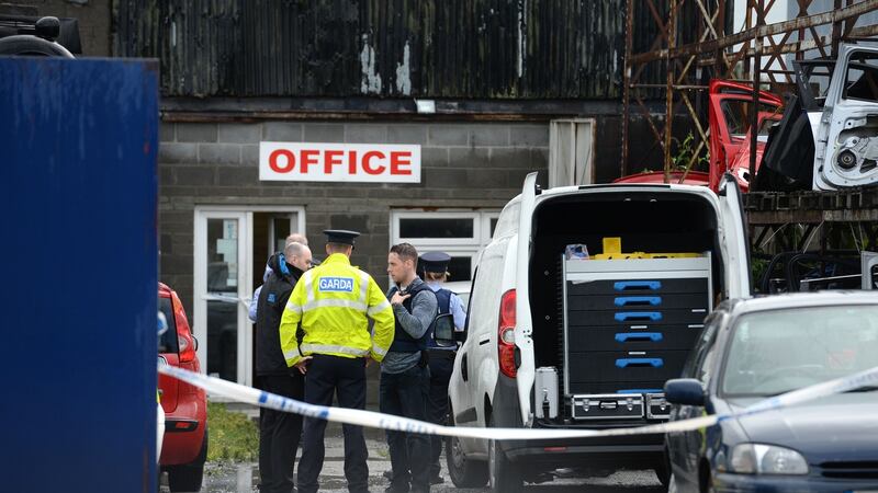 Gardaí at the scene of a shooting on the Greenhills Road, Walkinstown, Dublin. Photograph: Dara Mac Dónaill/The Irish Times