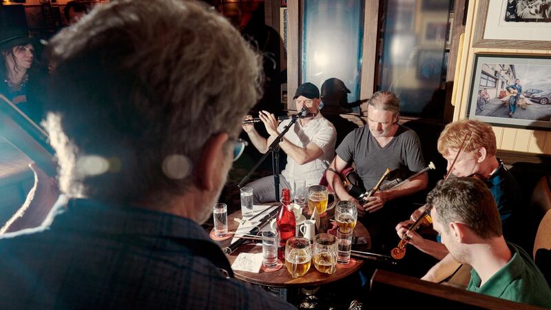 Kevin Crawford, Cillian Vallely, Sean Smyth and Patrick Doocey, who are all part of the band Lunasa, play at the Dead Rabbit in New York. Photograph: Vincent Tullo/The New York Times