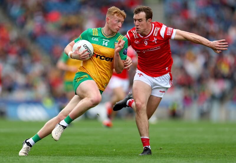 Donegal’s Oisin Gallen and Bevan Duffy of Louth. Photograph: James Crombie/Inpho