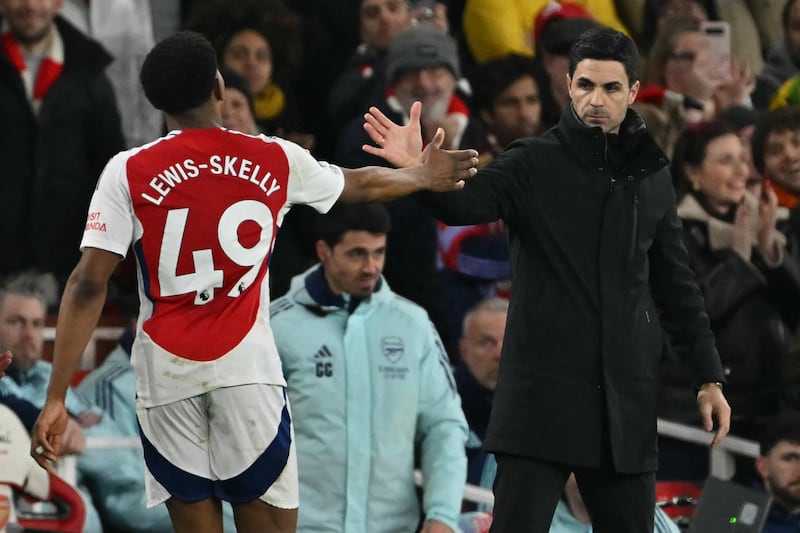 Arsenal manager Mikel Arteta greets Myles Lewis-Skelly after he was substituted during the Premier League match against Manchester City at the Emirates Stadium. Photograph: Glyn Kirk/AFP via Getty Images          