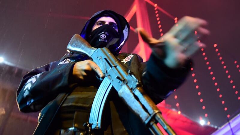 Reina attack: a policeman guards the nightclub where 39 people were killed on New Year’s Day. Photograph: AFP